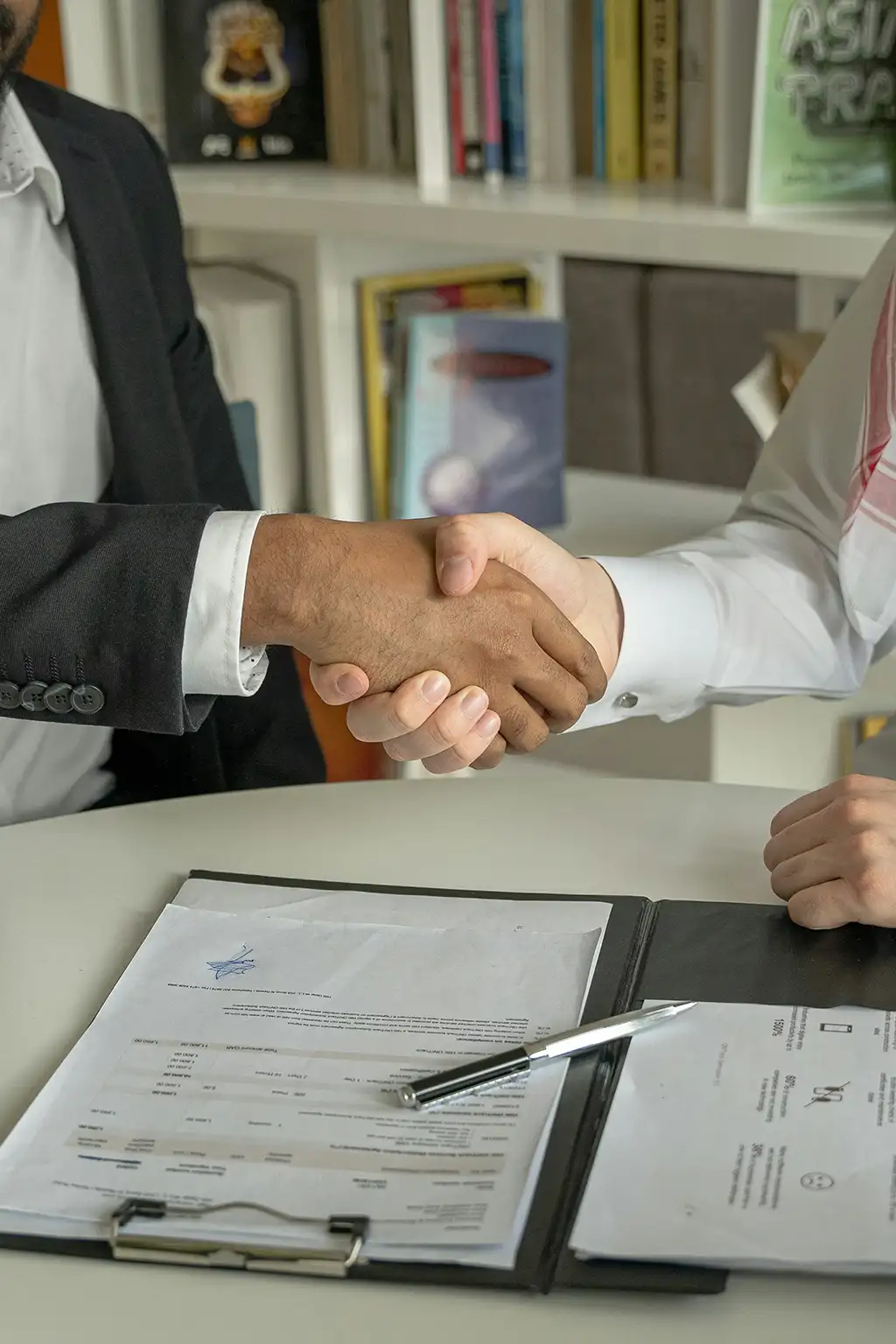 Handshake agreeing a private label safety footwear sourcing programme