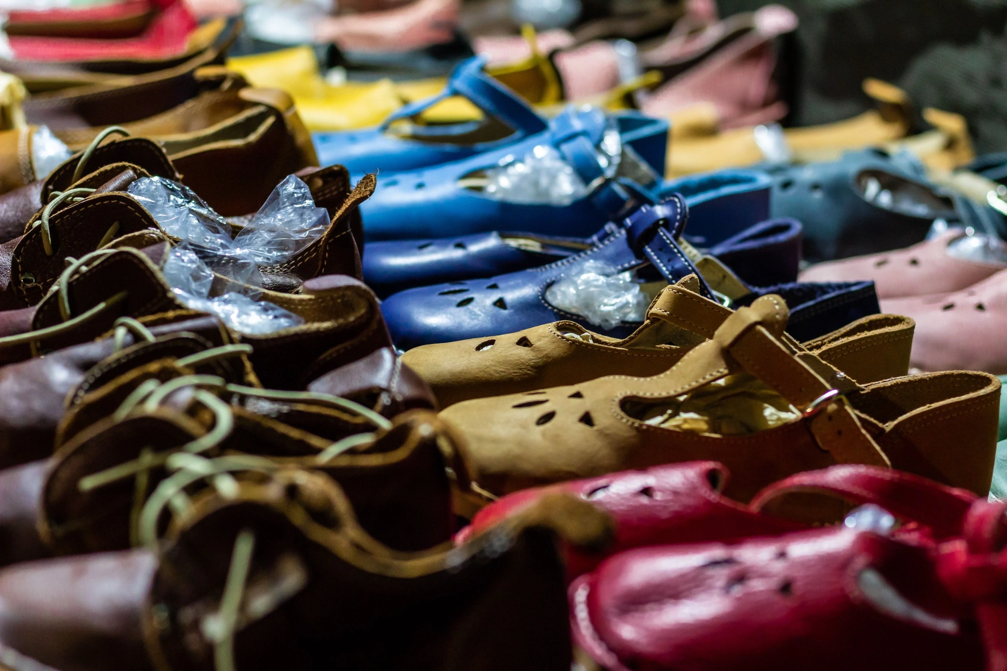 Footwear uppers and soles in production at a partner safety footwear factory in India